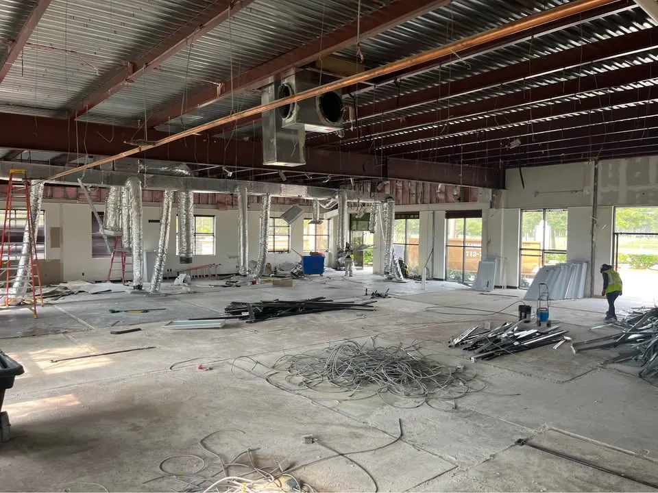 Open commercial interior with exposed ceiling systems from the SiteClear work collection